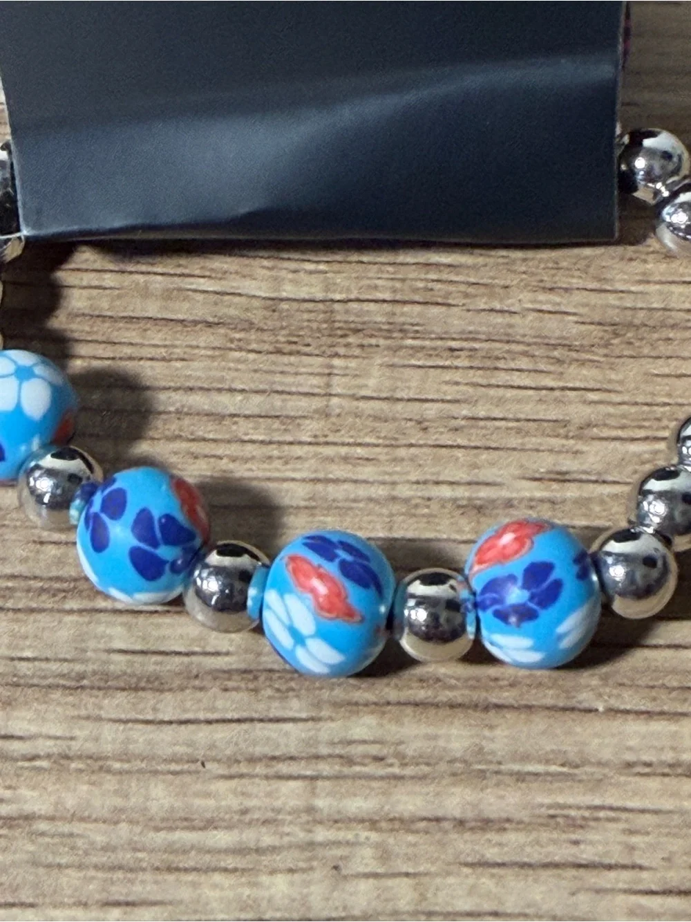 paparazzi Blue Floral Stretch Bracelet with Silver Beads and Red Accents
